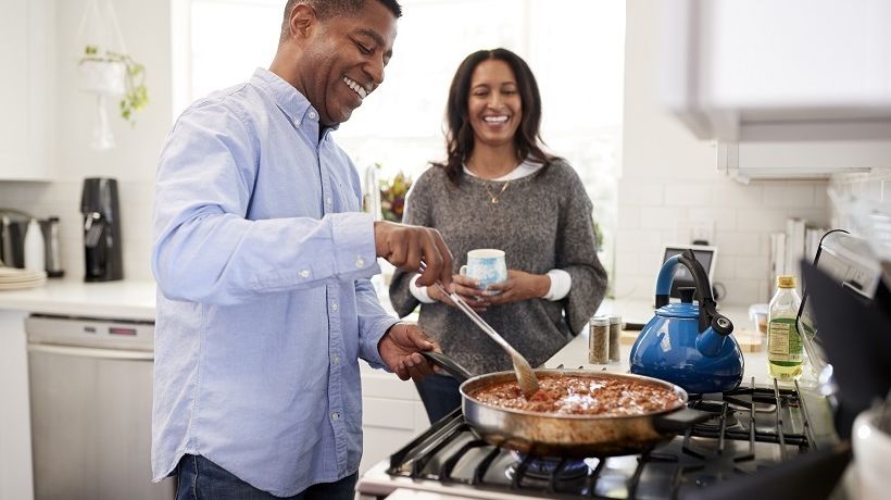 Man and woman cooking for healthy gastro intestinal health