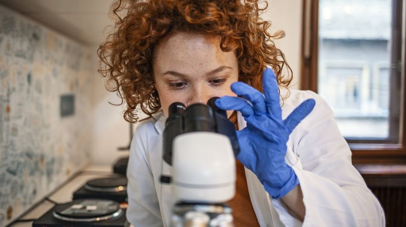 Woman reviewing Blood Draw sample for medical lab services