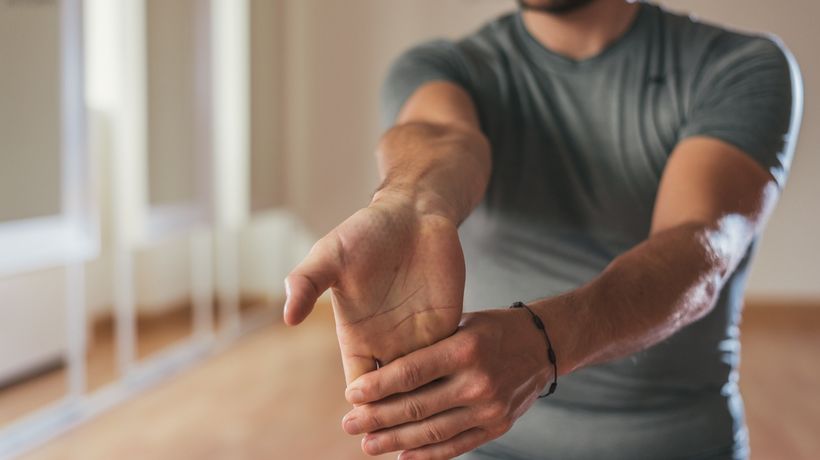 Occupational therapist showing hand therapy stretch